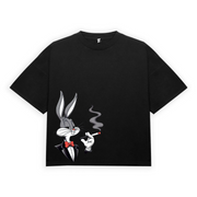 Black oversize t-shirt with a graphic print of a cartoon character on the front.